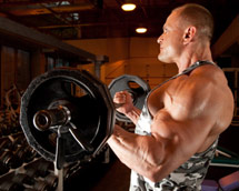 BodyBuilder Pushing Weight Biceps